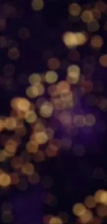 Abstract bokeh wallpaper with golden lights and dark purple background.