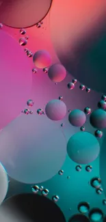 Colorful abstract bubbles wallpaper in teal, pink, and orange hues.