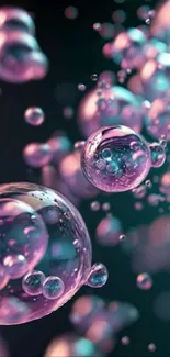 Abstract wallpaper with pink and teal bubbles on a dark background.