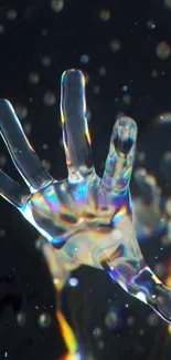 Crystal hand with rainbow hues on a dark background.