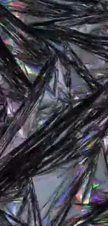 Abstract crystalline texture with iridescent highlights on a gray background.