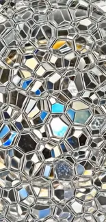 Abstract geometric glass design with metallic reflections.