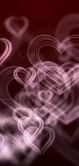 Abstract wallpaper with soft pink hearts on a maroon background.