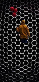 Man stands in front of hexagon pattern with vibrant neon lights.