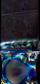 Abstract liquid flow with vibrant colors on black background wallpaper.