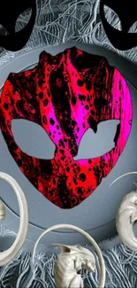 Vibrant abstract mask with red hues and artistic design.