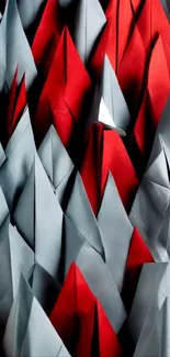 Abstract origami wallpaper with red and gray geometric shapes.