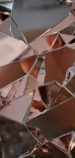 Shattered mirror surface creating abstract art in copper tones.