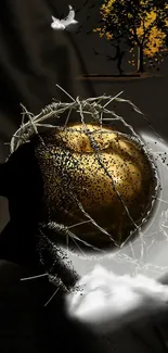 Abstract silhouette with gold orb and barbed wire on black background.