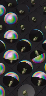 Abstract wallpaper with colorful spheres on a dark grid background.