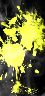 Vibrant abstract yellow paint splash on black mobile wallpaper.