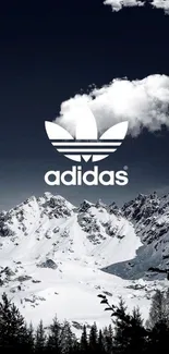 Adidas logo over snowy mountain landscape with dark sky.