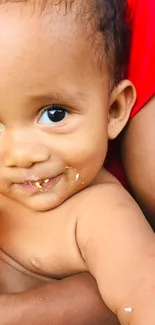 Adorable baby with sweet expression and close-up smile in vibrant colors.