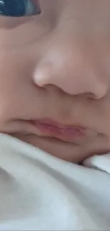 Adorable baby face close-up wallpaper.