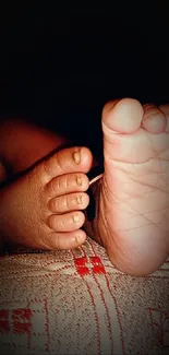 Close-up of adorable baby feet against a warm brown background