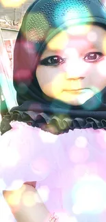 Cute baby in pink dress and black hijab wallpaper.