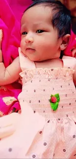 Adorable baby in a pink dress, perfect mobile wallpaper.