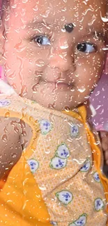 Smiling baby behind glass with raindrops, in vibrant colors.