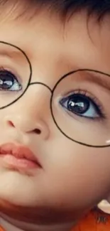 Adorable baby with round glasses looking thoughtful.