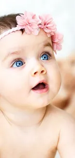 Adorable baby with pink headband and teddy bears on white background.