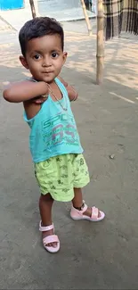 Young child in summer outfit looking adorable outdoors.