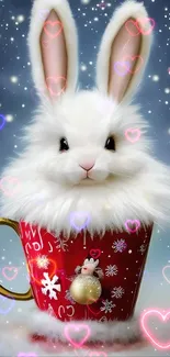 White bunny in a red Christmas mug with snowflakes falling.