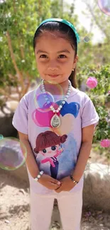 Adorable young girl smiling with colorful bubbles in nature.