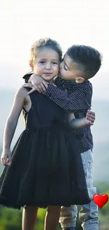 Adorable kids hugging with scenic background.