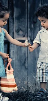 Two children sharing a moment in denim blues.