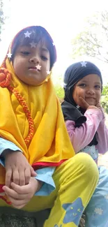 Adorable children smiling outdoors under sunlight.