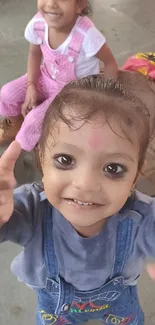 Two adorable kids smiling, capturing joyful innocence.