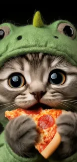 Cute kitten in a dinosaur costume holding pizza.