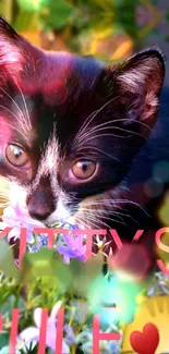 Cute kitten in a colorful floral nature setting wallpaper.