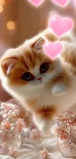 Adorable kitten with pink hearts and flowers.