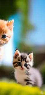 Two adorable kittens posing in a vibrant natural setting.