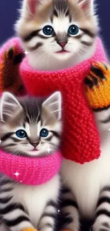 Two adorable kittens in scarves and mittens against a blue background.