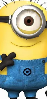 Adorable Minion in blue overalls with a cheerful expression on a mobile wallpaper.