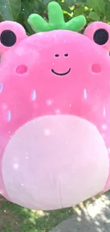 Adorable pink plush toy with a smile.