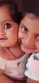 Adorable siblings embracing with warm smiles.