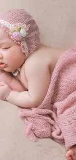 Adorable baby sleeping in pink blanket, serene and peaceful.