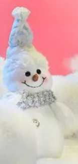 Fluffy snowman with pink background, ideal for winter mobile wallpaper.