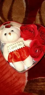 Heart-shaped box with teddy bear and roses.