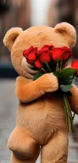 Cute teddy bear with red roses on a street.