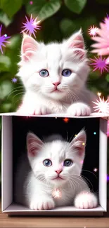 Adorable white kittens in a floral setting with pink flowers and green leaves.