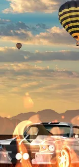 Classic car and hot air balloons at sunset with a motorbike jump.