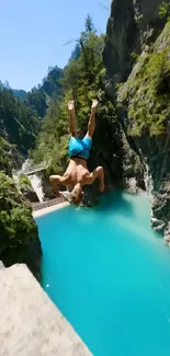 Person cliff diving into turquoise water in a scenic gorge.