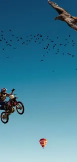 Motorbike and bird soaring in a dramatic sky, capturing the essence of adventure.