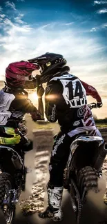 Two motorcyclists at sunset with a beautiful scenic background.