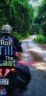 Motorcyclist rides through lush forest.