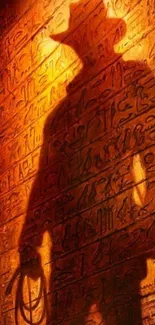 Silhouette of an adventurer on ancient hieroglyphic wall with warm orange light.